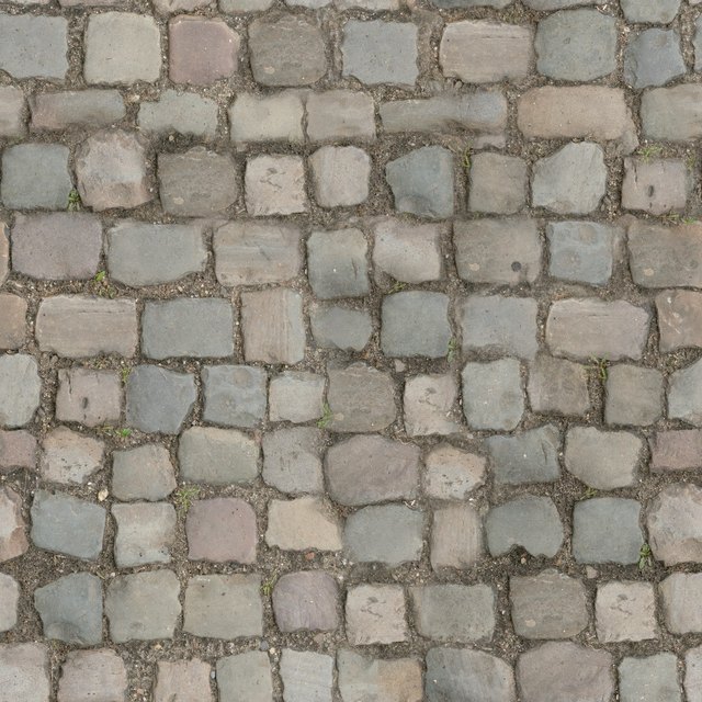 A photo of a cobblestone floor, taken straight down
